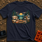 Then And Now - T-Shirt in Navy - A detailed illustration of a campsite by a mountain lake at sunset, comparing a vintage...