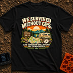 Lost In The Fold - T-Shirt in Black - A retro-style illustration featuring an unfolded paper map and a compass in the...