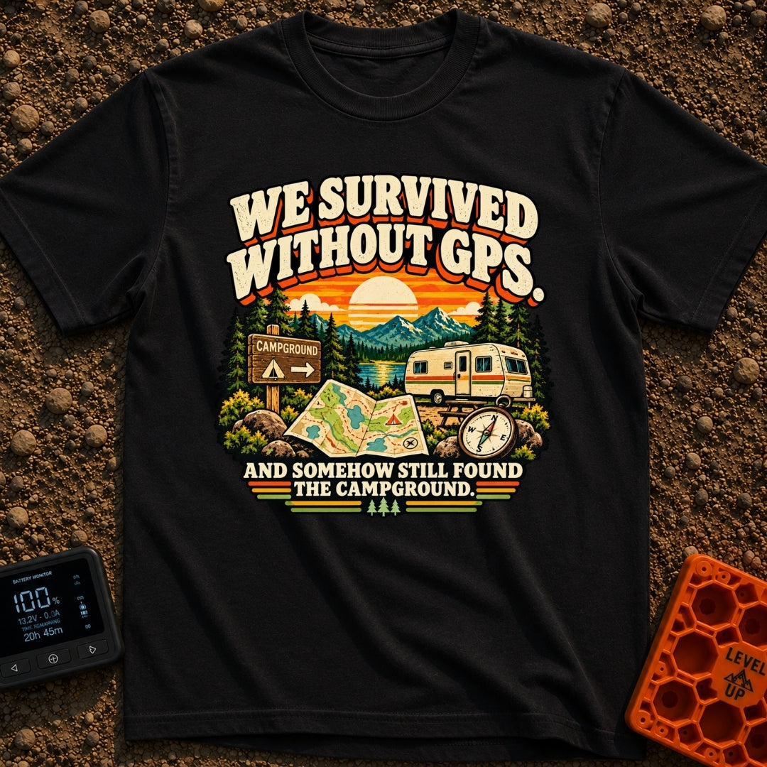 Lost In The Fold - T-Shirt in Black - A retro-style illustration featuring an unfolded paper map and a compass in the...