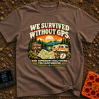 Lost In The Fold - T-Shirt in Espresso - A retro-style illustration featuring an unfolded paper map and a compass in the...
