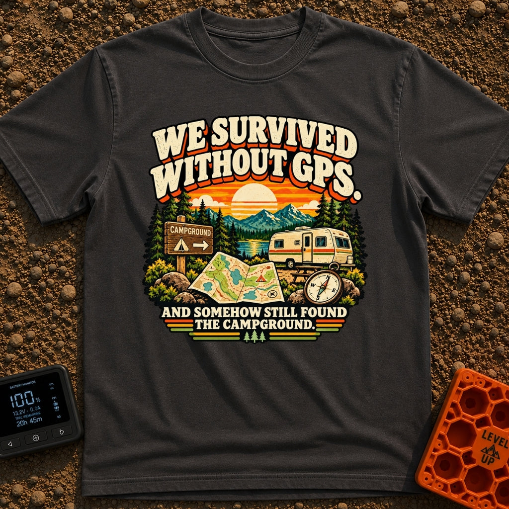 Lost In The Fold - T-Shirt in Graphite - A retro-style illustration featuring an unfolded paper map and a compass in the...