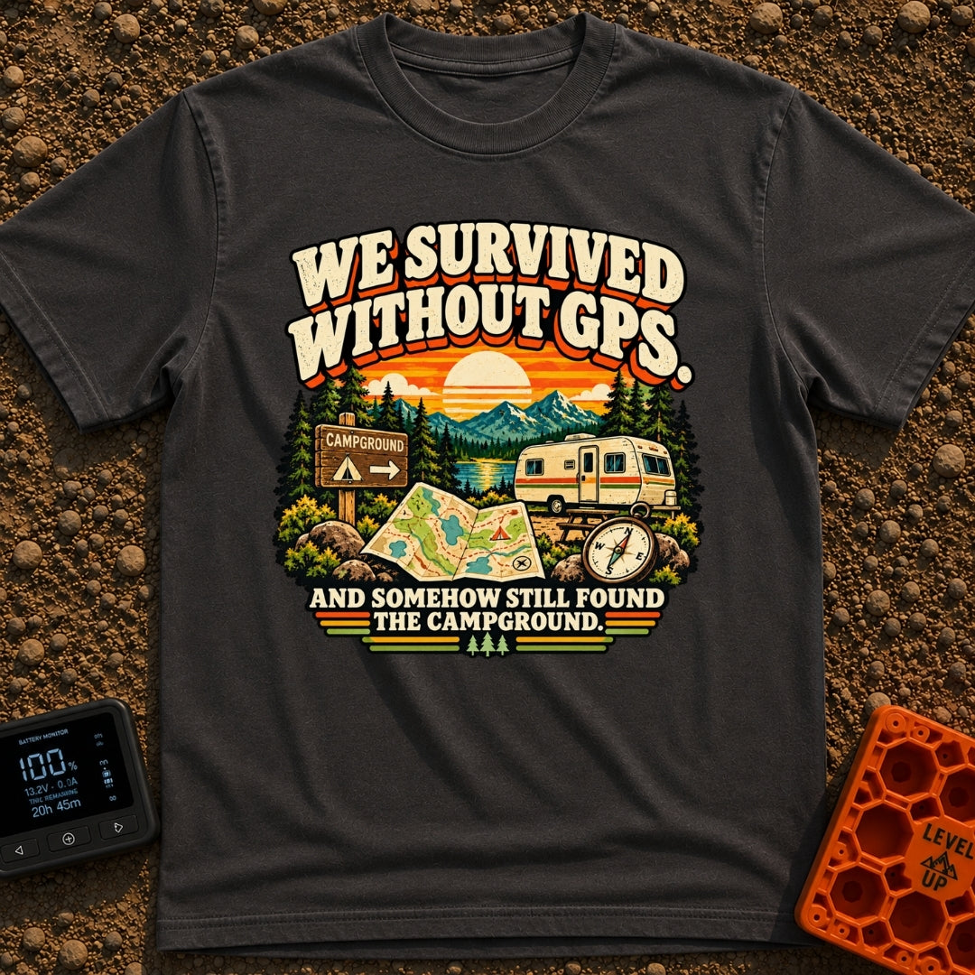 Lost In The Fold - T-Shirt in Graphite - A retro-style illustration featuring an unfolded paper map and a compass in the...