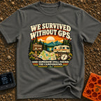 Lost In The Fold - T-Shirt in Pepper - A retro-style illustration featuring an unfolded paper map and a compass in the...