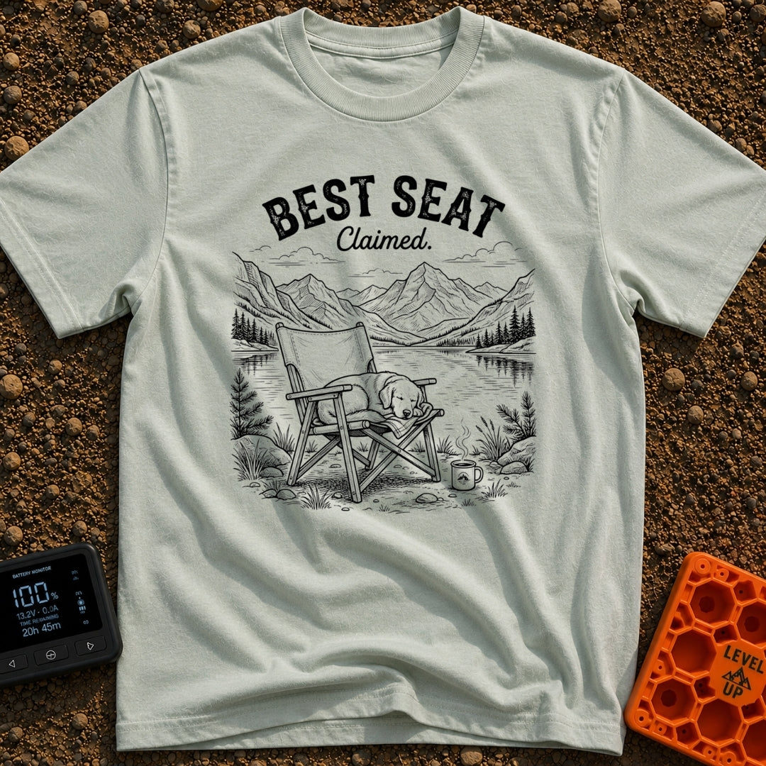 Best Seat Claimed - T-Shirt in Bay - A black-and-white line drawing of a dog sleeping curled up in a folding camp chair....