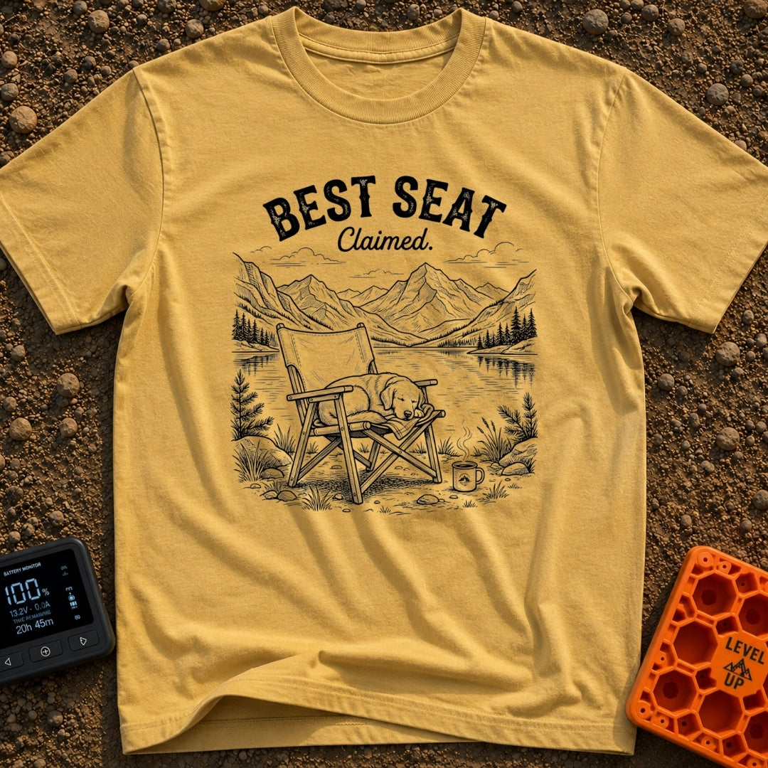 Best Seat Claimed - T-Shirt in Mustard - A black-and-white line drawing of a dog sleeping curled up in a folding camp...