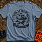 Big Tool Energy - T-Shirt in Blue Jean - A circular distressed emblem featuring a camper van above a crossed wrench and a...