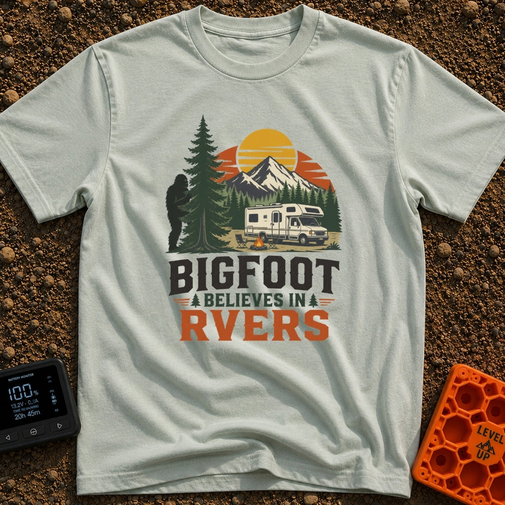 Bigfoot Believes In Us - T-Shirt in Bay - A graphic showing a silhouette of Bigfoot peeking from behind a large pine tree...