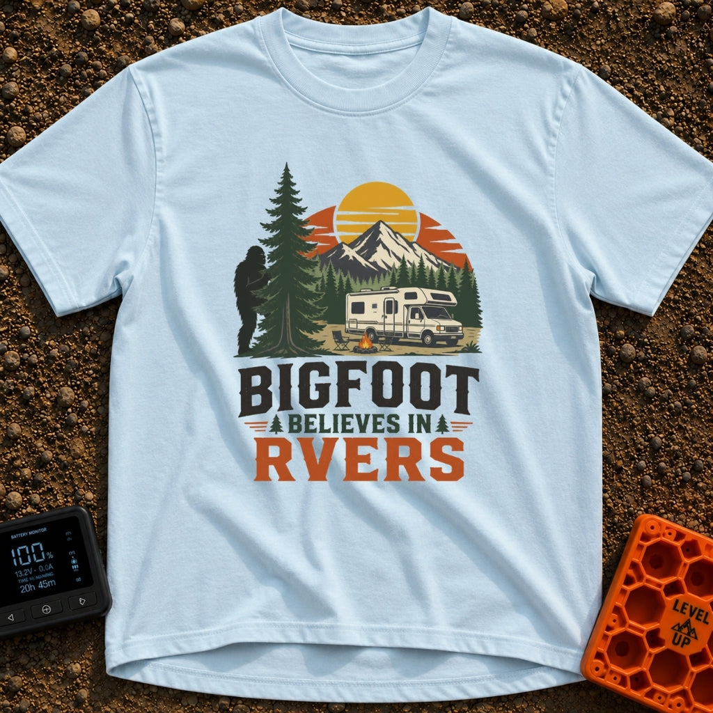 Bigfoot Believes In Us - T-Shirt in Chambray - A graphic showing a silhouette of Bigfoot peeking from behind a large pine...