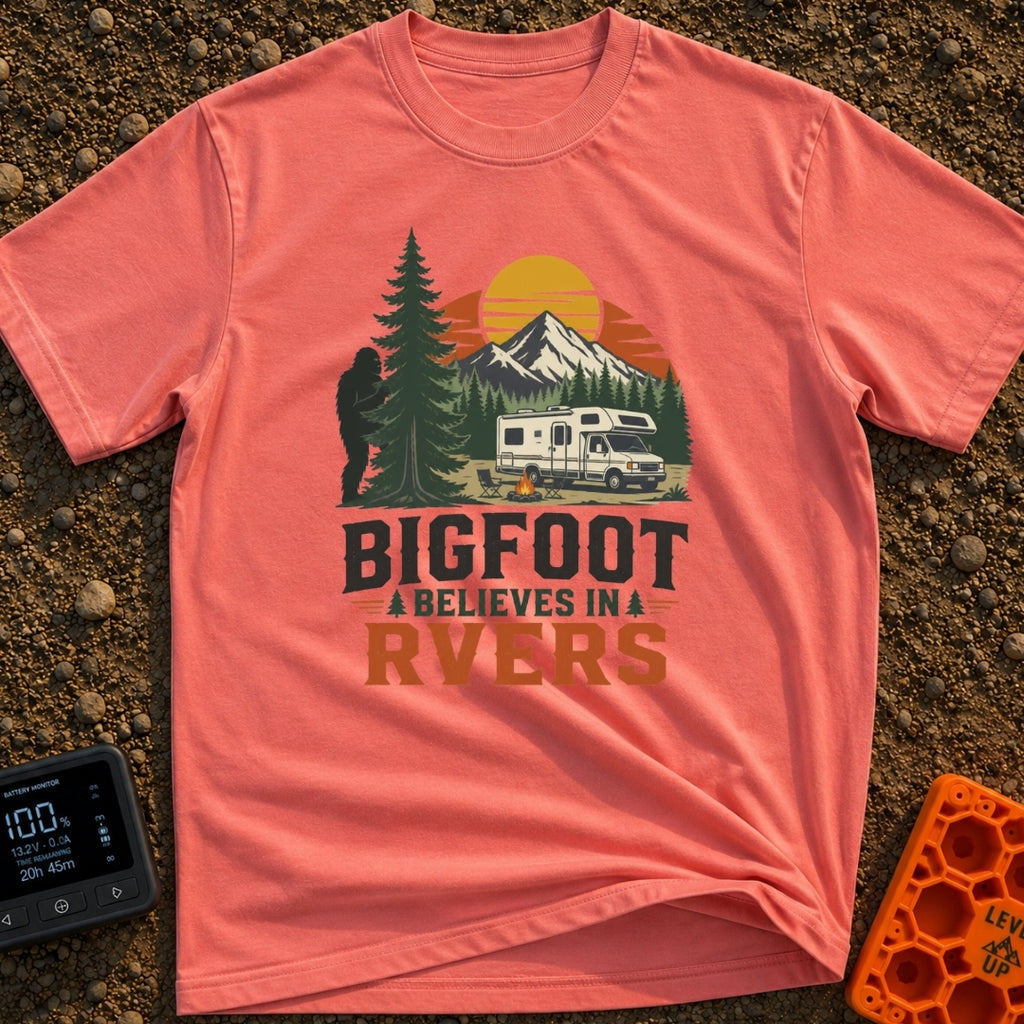 Bigfoot Believes In Us - T-Shirt in Watermelon - A graphic showing a silhouette of Bigfoot peeking from behind a large...