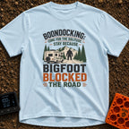 Bigfoot Right Of Way - T-Shirt in Chambray - An illustration of a Class C motorhome stopped on a dirt road facing a large...