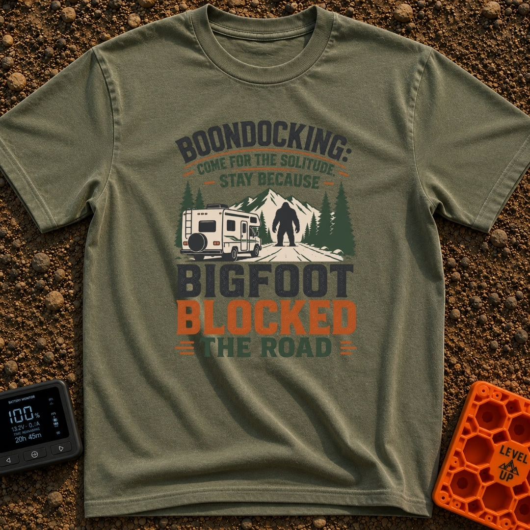 Bigfoot Right Of Way - T-Shirt in Moss - An illustration of a Class C motorhome stopped on a dirt road facing a large...