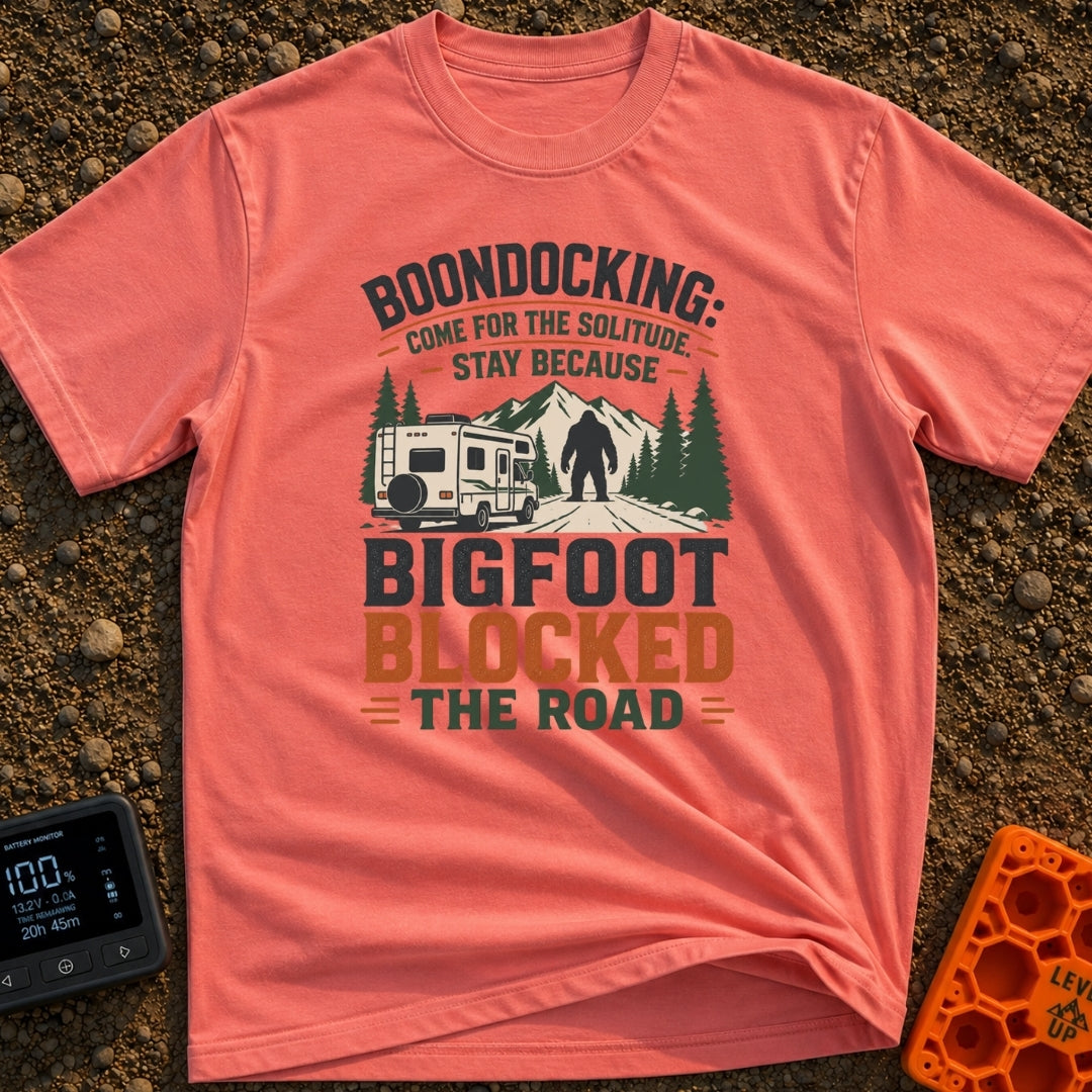 Bigfoot Right Of Way - T-Shirt in Watermelon - An illustration of a Class C motorhome stopped on a dirt road facing a...