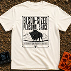 Bison Social Distancing - T-Shirt in Ivory - A black and white graphic resembling a warning sign featuring an...