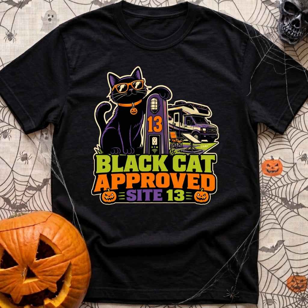 Black Cat Approved - T-Shirt in Black - A black cat wearing orange sunglasses and a pumpkin collar tag leans on a...