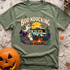 Boondocking With My Boo - T-Shirt in Moss - A cartoon illustration of an RV parked in a desert landscape at night under a...