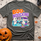 Boo Ndocking After Dark - T-Shirt in Pepper - A cartoon illustration of two friendly ghosts setting up a campsite in...