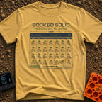 Calendar of Campers - T-Shirt in Mustard - A graphic of a digital calendar interface where every day of the month is...