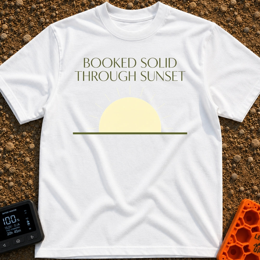 Booked Till Sunset - T-Shirt in White - The image features the text "BOOKED SOLID THROUGH SUNSET" in a dark olive green,...