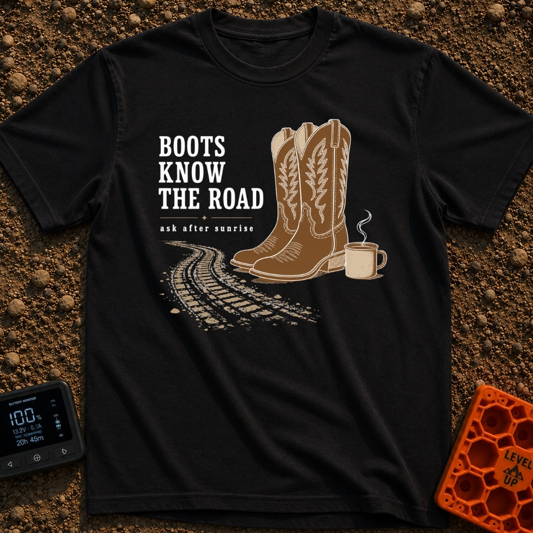 Boots Know Best - T-Shirt in Black - A pair of decorated brown western boots standing next to a steaming camp mug, with...
