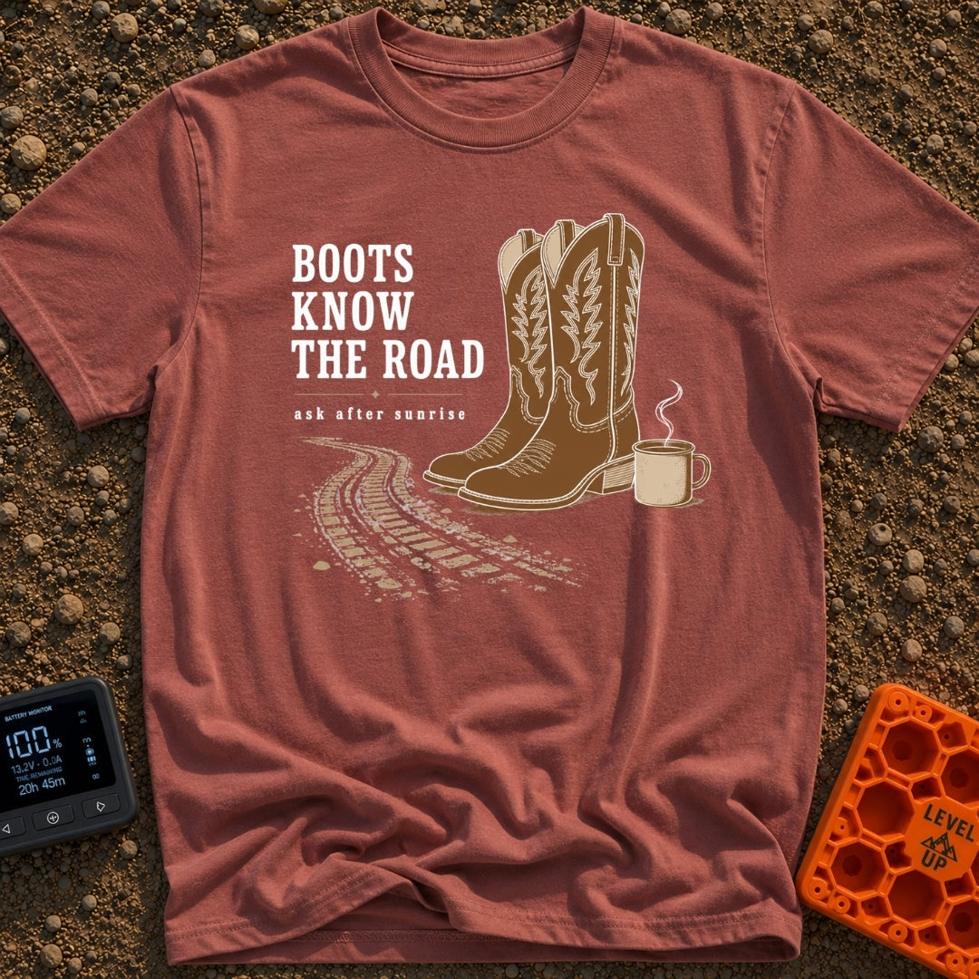 Boots Know Best - T-Shirt in Brick - A pair of decorated brown western boots standing next to a steaming camp mug, with...