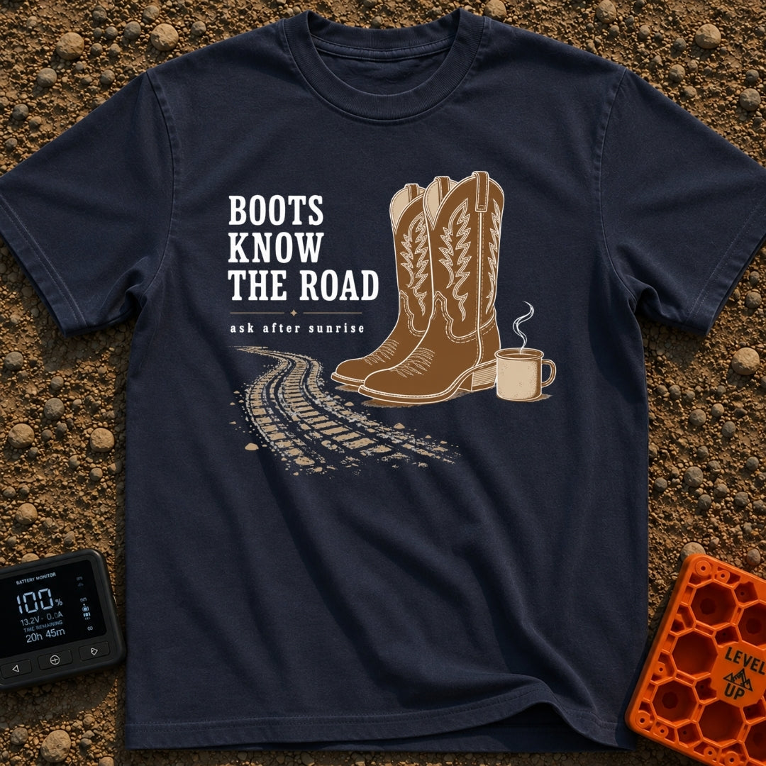 Boots Know Best - T-Shirt in Navy - A pair of decorated brown western boots standing next to a steaming camp mug, with...