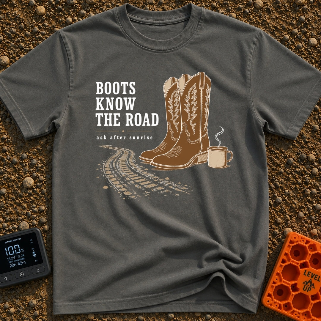 Boots Know Best - T-Shirt in Pepper - A pair of decorated brown western boots standing next to a steaming camp mug, with...