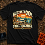 Born In A Barn - T-Shirt in Black - A retro-style illustration of a vintage Class A motorhome driving along a winding...
