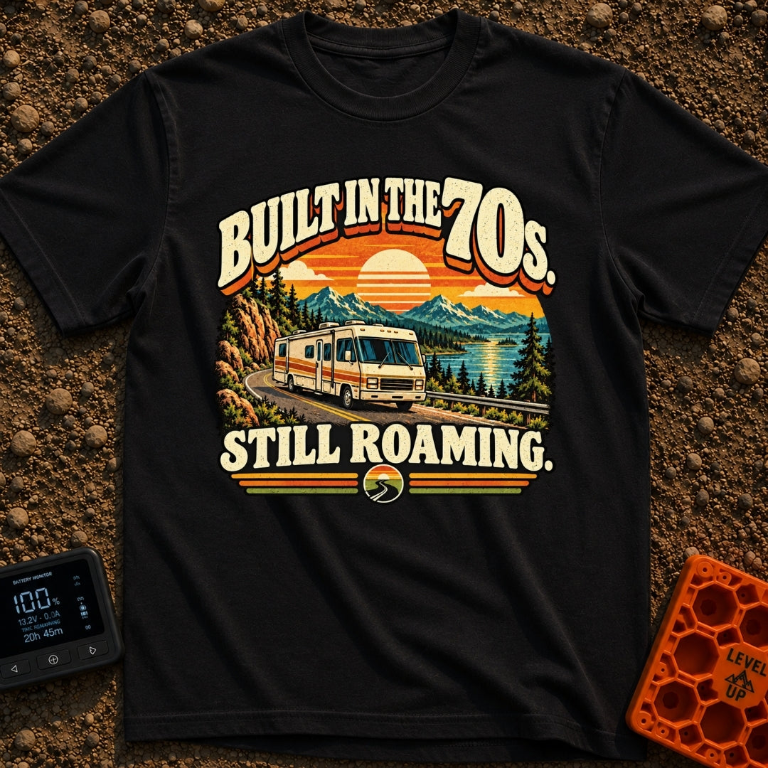 Born In A Barn - T-Shirt in Black - A retro-style illustration of a vintage Class A motorhome driving along a winding...