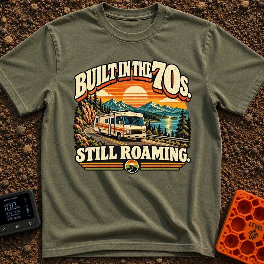 Born In A Barn - T-Shirt in Moss - A retro-style illustration of a vintage Class A motorhome driving along a winding road...