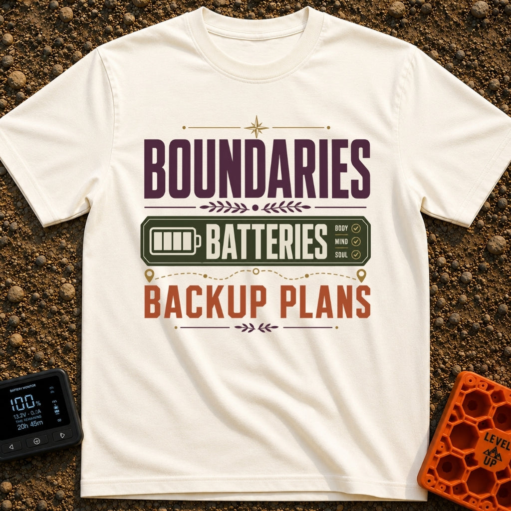 Boundaries And Batteries - T-Shirt in Ivory - A typographic design featuring the stacked words 'BOUNDARIES', 'BATTERIES',...