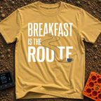 Route To Breakfast - T-Shirt in Mustard - A minimalist illustration of a winding two-lane road with double yellow lines...