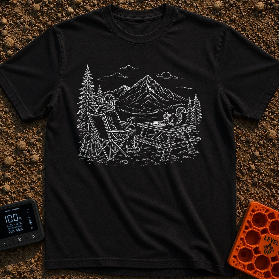 Squirrel's Breakfast Bargain - T-Shirt in Black - A line illustration of a man sitting in a camp chair holding a mug,...
