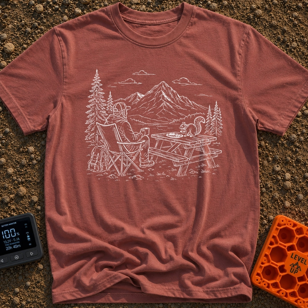 Squirrel's Breakfast Bargain - T-Shirt in Brick - A line illustration of a man sitting in a camp chair holding a mug,...
