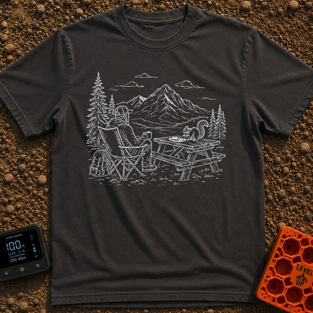 Squirrel's Breakfast Bargain - T-Shirt in Graphite - A line illustration of a man sitting in a camp chair holding a mug,...