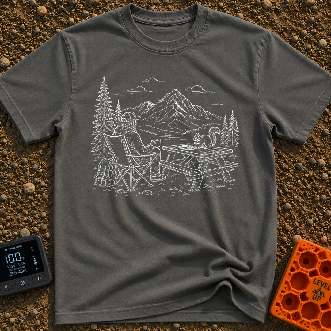 Squirrel's Breakfast Bargain - T-Shirt in Pepper - A line illustration of a man sitting in a camp chair holding a mug,...