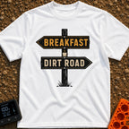 Breakfast Next Dirt Road - T-Shirt in White - A graphic of a wooden directional signpost with two arrows; the top arrow...