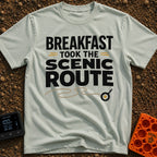 Breakfast Gone Scenic - T-Shirt in Bay - Bold text reading "BREAKFAST TOOK THE SCENIC ROUTE" accompanied by a winding tan...