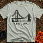 Bridging The Bars - T-Shirt in Bay - A black and white illustration of a suspension bridge where the vertical cables are...