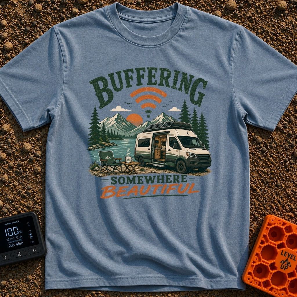Buffering In The Wild - T-Shirt in Blue Jean - A camper van with roof-mounted solar panels is parked beside a mountain...