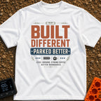 Built Different Parked - T-Shirt in White - A typographic design reading 'BUILT DIFFERENT' and 'PARKED BETTER' in large...