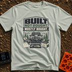 Built But Mostly Bought - T-Shirt in Bay - A graphic illustration featuring an off-road 4x4 vehicle with a front winch,...