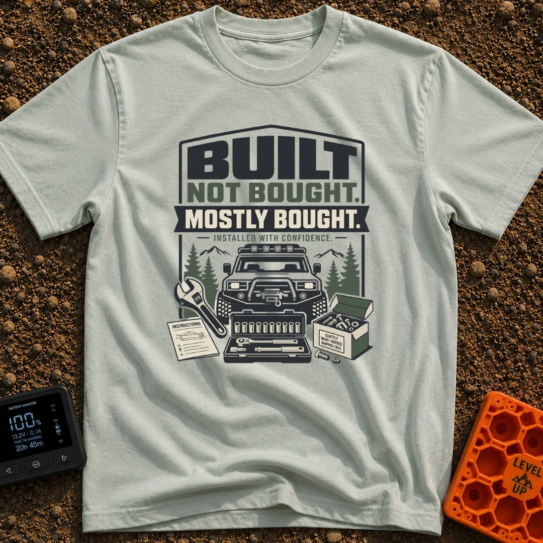 Built But Mostly Bought - T-Shirt in Bay - A graphic illustration featuring an off-road 4x4 vehicle with a front winch,...