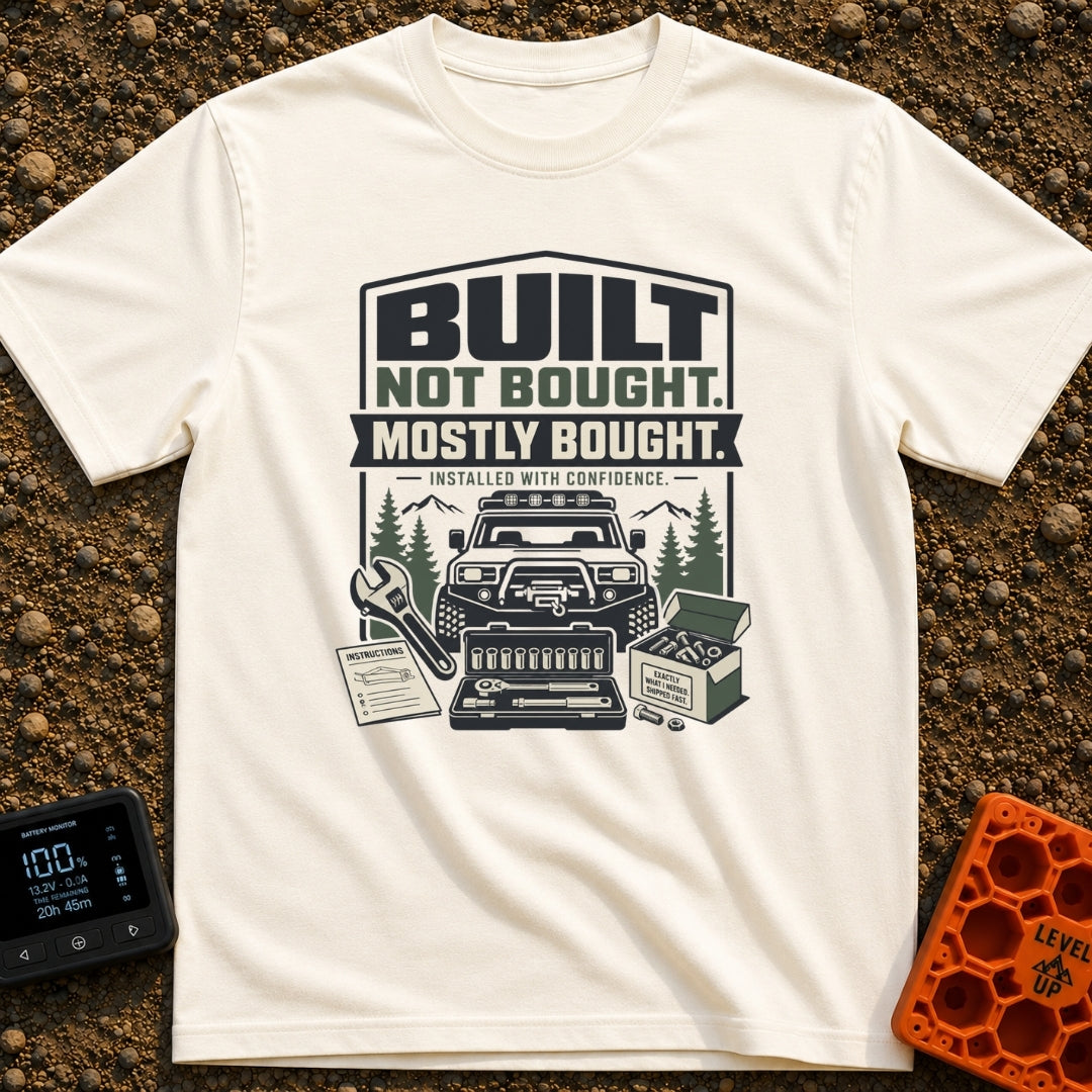 Built But Mostly Bought - T-Shirt in Ivory - A graphic illustration featuring an off-road 4x4 vehicle with a front winch,...
