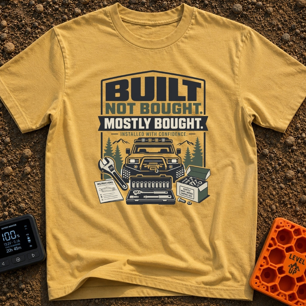 Built But Mostly Bought - T-Shirt in Mustard - A graphic illustration featuring an off-road 4x4 vehicle with a front...