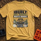Built But Mostly Bought - T-Shirt in Mustard - A graphic illustration featuring an off-road 4x4 vehicle with a front...