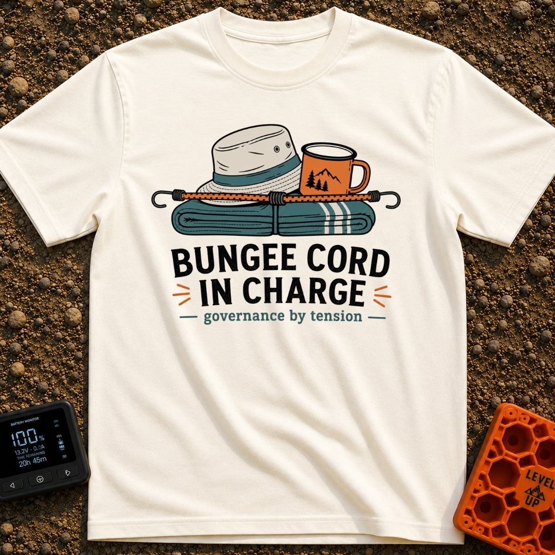 Bungee In Charge - T-Shirt in Ivory - A folded teal blanket, a light-colored bucket hat, and an orange camp mug with a...