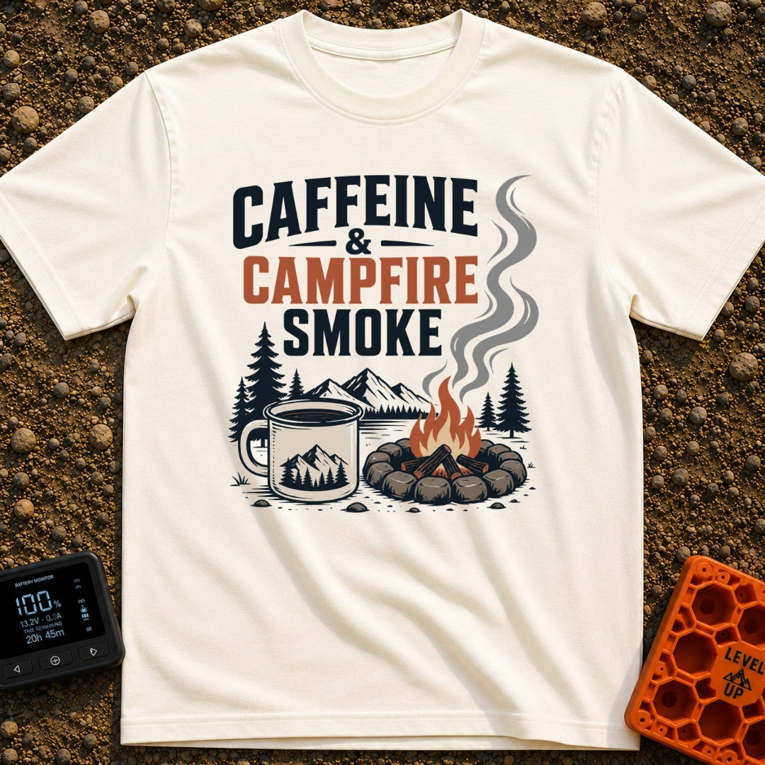 Caffeine And Campfires - T-Shirt in Ivory - A large camp mug filled with coffee next to a stone-ringed campfire with...