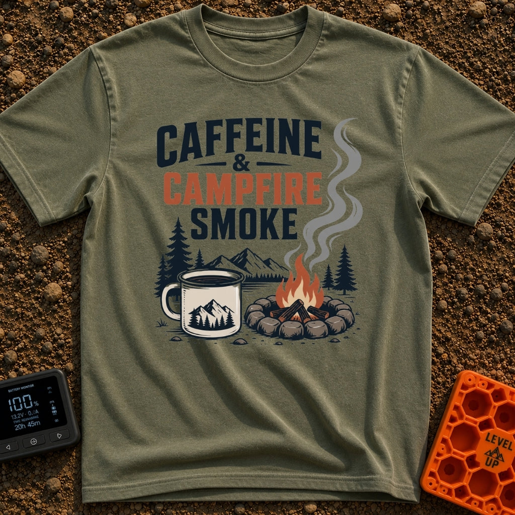 Caffeine And Campfires - T-Shirt in Moss - A large camp mug filled with coffee next to a stone-ringed campfire with...
