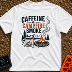 Caffeine And Campfires - T-Shirt in White - A large camp mug filled with coffee next to a stone-ringed campfire with...