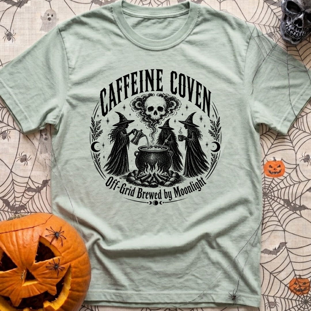 Wake The Coven - T-Shirt in Bay - A black and white circular illustration of three witches standing around a cauldron...